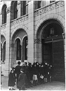 Title: [Free dental care for children at the Guggenheim Dental Clinic, New York   City: line of children waiting to enter the clinic] Date Created/Published: [between 