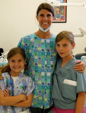 Home page for pediatric dentist Dr. Kim Feuquay in The Woodlands, Texas and   the surrounding cities of Magnolia, Conroe, Tomball, and Shenandoah, TX.